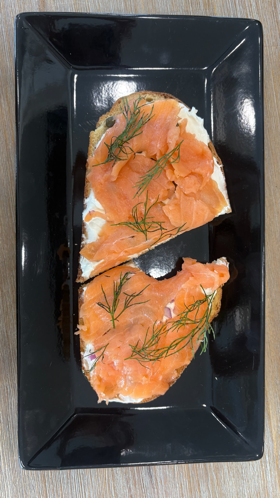 Lox'd & Loaded toast, one bite in